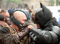 Tom Hardy as Bane battles Christian Bale as Batman in one of the top films of 2012, The Dark Knight Rises