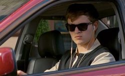 Ansel Elgort puts on some driving music in the top 2017 action film, Baby Driver.